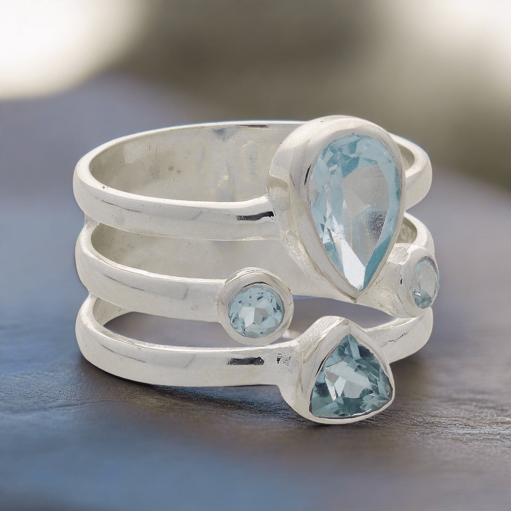 Buy your Triple Band Sterling Silver Ring with Cascading Blue Topaz Quartet online now or in store at Forever Gems in Franschhoek, South Africa