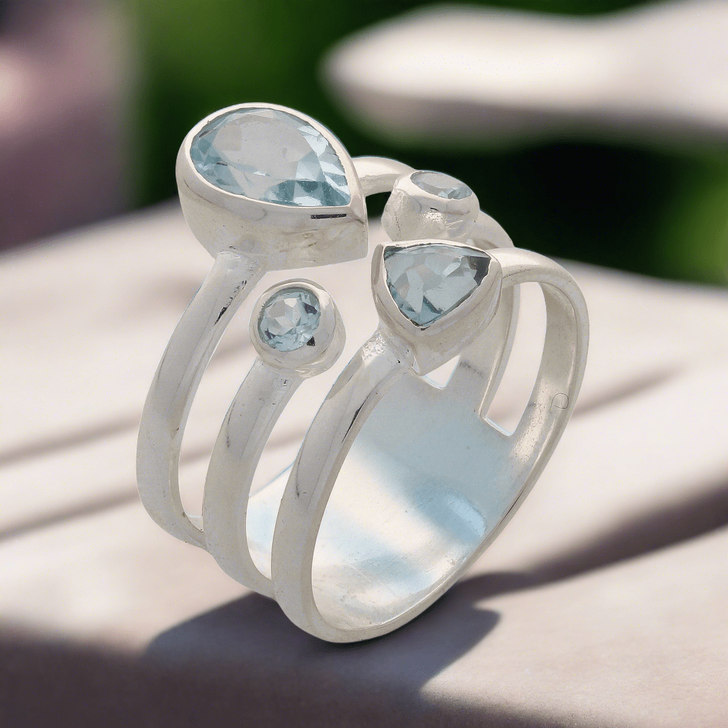 Buy your Triple Band Sterling Silver Ring with Cascading Blue Topaz Quartet online now or in store at Forever Gems in Franschhoek, South Africa