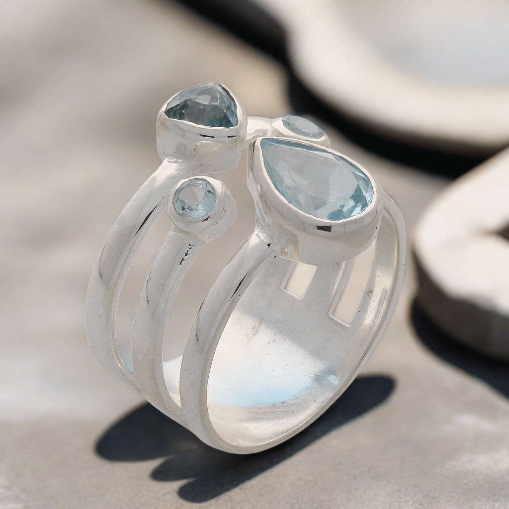 Buy your Triple Band Sterling Silver Ring with Cascading Blue Topaz Quartet online now or in store at Forever Gems in Franschhoek, South Africa