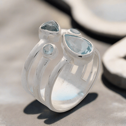 Buy your Triple Band Sterling Silver Ring with Cascading Blue Topaz Quartet online now or in store at Forever Gems in Franschhoek, South Africa