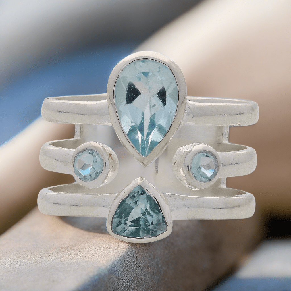 Buy your Triple Band Sterling Silver Ring with Cascading Blue Topaz Quartet online now or in store at Forever Gems in Franschhoek, South Africa