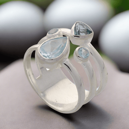 Buy your Triple Band Sterling Silver Ring with Cascading Blue Topaz Quartet online now or in store at Forever Gems in Franschhoek, South Africa